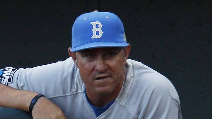 June 17, 2012; Omaha, NE, USA;  UCLA Bruins head coach John Savage watches from the dugout prior to the game against the Arizona Wildcats in six of the 2012 College World Series at TD Ameritrade Park. Mandatory Credit: Bruce Thorson-Imagn Images