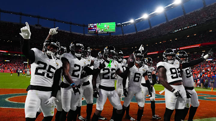 Dec 21, 2025; Denver, Colorado, USA; The Jacksonville Jaguars defense reacts during the second half at Empower Field at Mile High. Mandatory Credit: Ron Chenoy-Imagn Images