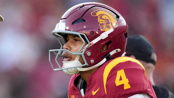 Aug 30, 2025; Los Angeles, California, USA; Southern California Trojans head coach Lincoln Riley talks with Southern California Trojans quarterback Husan Longstreet (4) in the second half against the Missouri State Bears at United Airlines Field at Los Angeles Memorial Coliseum. Mandatory Credit: Kirby Lee-Imagn Images