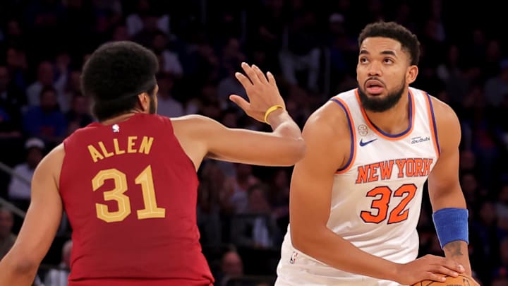 Oct 22, 2025; New York, New York, USA; New York Knicks center Karl-Anthony Towns (32) controls the ball against Cleveland Cavaliers center Jarrett Allen (31) during the fourth quarter at Madison Square Garden. Mandatory Credit: Brad Penner-Imagn Images