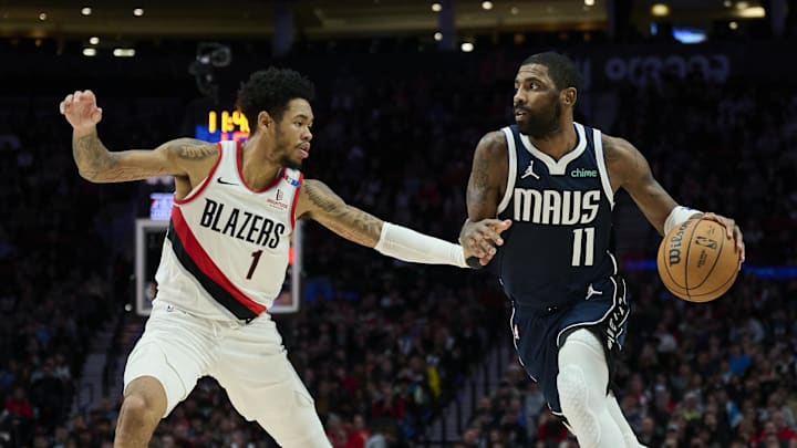 Dec 28, 2024; Portland, Oregon, USA; Dallas Mavericks guard Kyrie Irving (11) drives to the basket during the second half against Portland Trail Blazers guard Anfernee Simons (1) at Moda Center. Mandatory Credit: Troy Wayrynen-Imagn Images Dec 28, 2024; Portland, Oregon, USA; Dallas Mavericks guard Kyrie Irving (11) drives to the basket during the second half against Portland Trail Blazers guard Anfernee Simons (1) at Moda Center. Mandatory Credit: Troy Wayrynen-Imagn Images