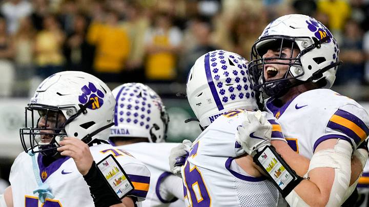 The Nevada Cubs react after defeating the Bishop Heelan Crusaders Nov. 21, 2025 in the Class 3A high school state football championship at the UNI-Dome in Cedar Falls, Iowa. The Nevada Cubs react after defeating the Bishop Heelan Crusaders Nov. 21, 2025 in the Class 3A high school state football championship at the UNI-Dome in Cedar Falls, Iowa.