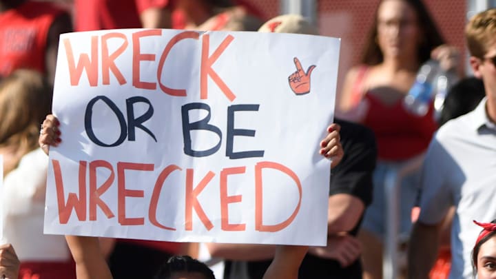 Texas Tech fans wave signs.