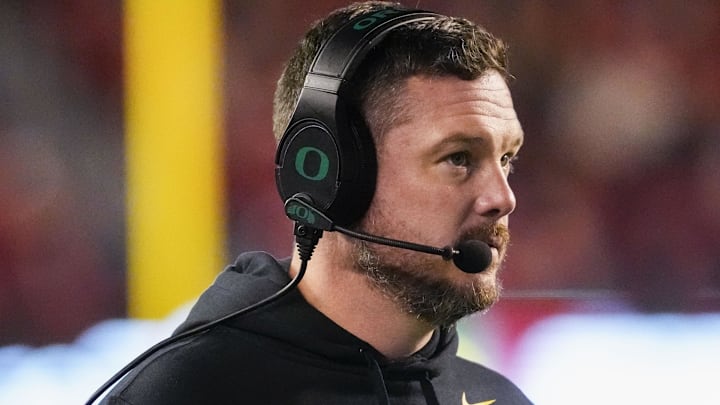 Nov 16, 2024; Madison, Wisconsin, USA;  Oregon Ducks head coach Dan Lanning looks on during the first quarter against the Wisconsin Badgers at Camp Randall Stadium. Mandatory Credit: Jeff Hanisch-Imagn Images