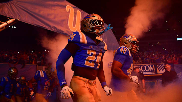 Nov 8, 2025; Pasadena, California, USA; UCLA Bruins wide receiver Jonah Smith (24) and linebacker Mone Malafu (40) take the field before playing against the Nebraska Cornhuskers at the Rose Bowl. Mandatory Credit: Gary A. Vasquez-Imagn Images Nov 8, 2025; Pasadena, California, USA; UCLA Bruins wide receiver Jonah Smith (24) and linebacker Mone Malafu (40) take the field before playing against the Nebraska Cornhuskers at the Rose Bowl. Mandatory Credit: Gary A. Vasquez-Imagn Images