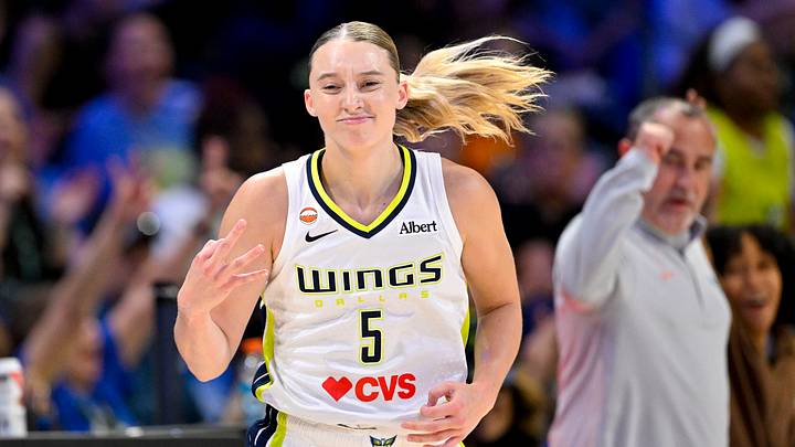 May 14, 2026; Arlington, Texas, USA; Dallas Wings guard Paige Bueckers (5) celebrates making a three point shot during the game between the Wings and the Lynx at College Park Center. Mandatory Credit: Jerome Miron-Imagn Images