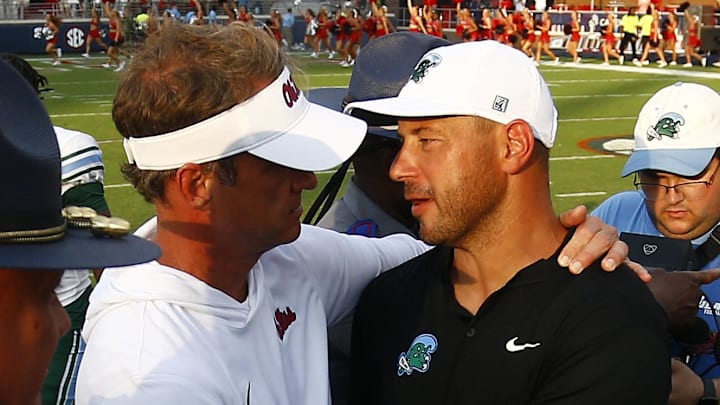 Sep 20, 2025; Oxford, Mississippi, USA; Mississippi Rebels head coach Lane Kiffin (left) and Tulane Green Wave head coach Jon Sumrall (right) embrace after the game at Vaught-Hemingway Stadium. Mandatory Credit: Petre Thomas-Imagn Images Sep 20, 2025; Oxford, Mississippi, USA; Mississippi Rebels head coach Lane Kiffin (left) and Tulane Green Wave head coach Jon Sumrall (right) embrace after the game at Vaught-Hemingway Stadium. Mandatory Credit: Petre Thomas-Imagn Images