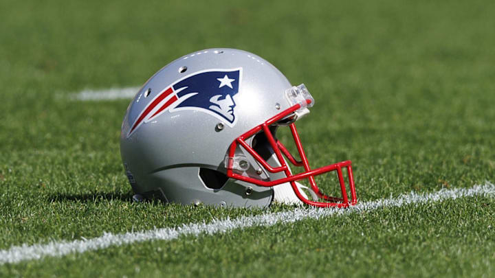 Oct 2, 2022; Green Bay, Wisconsin, USA;  A New England Patriots helmet sits on the field during warmups prior to the game against the Green Bay Packers at Lambeau Field. Mandatory Credit: Jeff Hanisch-USA TODAY Sports