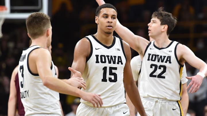 Feb 6, 2022; Iowa City, Iowa, USA; Iowa Hawkeyes forward Keegan Murray (15) and forward Patrick McCaffery (22) and guard Jordan Bohannon (3) react during the second half against the Minnesota Golden Gophers at Carver-Hawkeye Arena. Mandatory Credit: Jeffrey Becker-Imagn Images Feb 6, 2022; Iowa City, Iowa, USA; Iowa Hawkeyes forward Keegan Murray (15) and forward Patrick McCaffery (22) and guard Jordan Bohannon (3) react during the second half against the Minnesota Golden Gophers at Carver-Hawkeye Arena. Mandatory Credit: Jeffrey Becker-Imagn Images