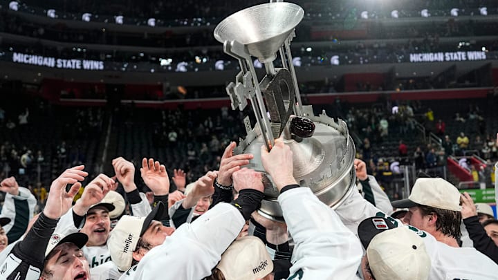 Michigan State players celebrate with the Iron D trophy after 5-2 win over Michigan at the Duel in the D at Little Caesars Arena in Detroit on Saturday, February 7, 2026.