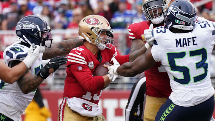 Nov 17, 2024; Santa Clara, California, USA; Seattle Seahawks defensive end Dre'Mont Jones (55) sacks San Francisco 49ers quarterback Brock Purdy (13) in the second quarter at Levi's Stadium.
