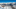 photo of Courchevel Airport surrounded by snowy mountains. 