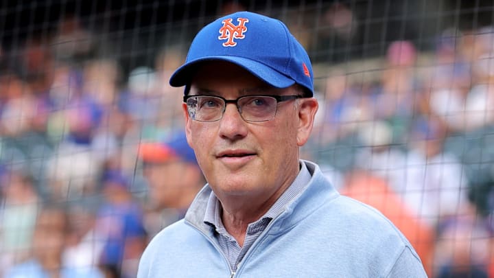 Aug 14, 2025; New York City, New York, USA; New York Mets owner Steve Cohen stands on the field before a ceremony to honor first baseman Pete Alonso (not pictured) for breaking the Mets all time home run record before a game against the Atlanta Braves at Citi Field. Mandatory Credit: Brad Penner-Imagn Images
