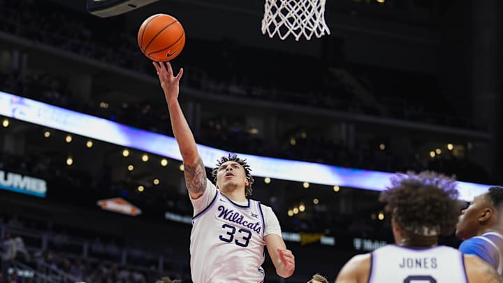 Dec 17, 2024; Kansas City, Missouri, USA; Kansas State Wildcats guard Coleman Hawkins (33) shoots during the first half against the Drake Bulldogs at T-Mobile Center. Mandatory Credit: Jay Biggerstaff-Imagn Images