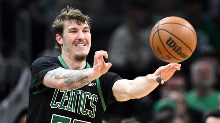 Mar 14, 2026; Boston, Massachusetts, USA; Boston Celtics guard Baylor Scheierman (55) passes the ball against the Washington Wizards during the first half at the TD Garden. Mandatory Credit: Brian Fluharty-Imagn Images