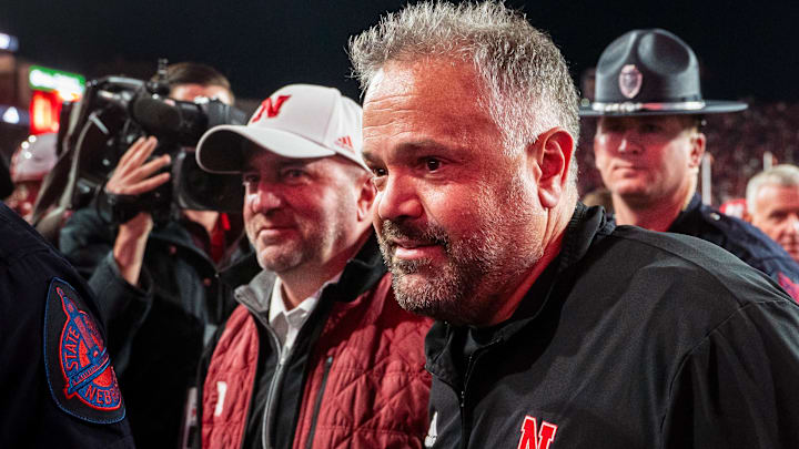 Matt Rhule and Troy Dannen walk off the field after the Huskers' win over Wisconsin last season.