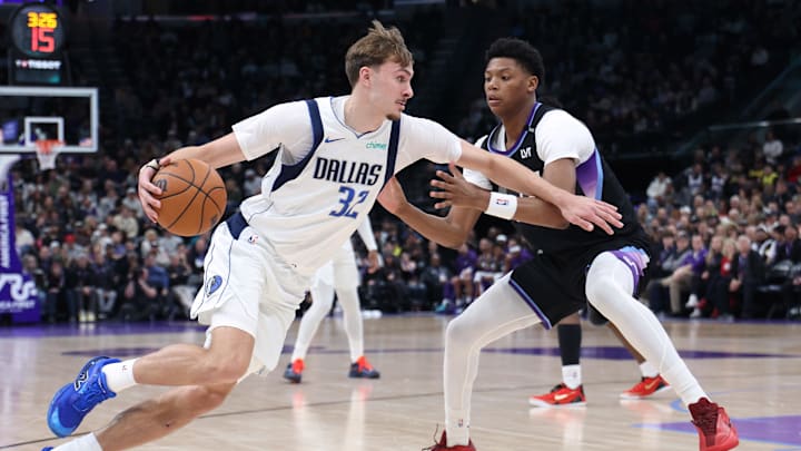 Dec 15, 2025; Salt Lake City, Utah, USA; Dallas Mavericks forward Cooper Flagg (32) drives to the basket against Utah Jazz guard Ace Bailey (19) during the second quarter at Delta Center. Mandatory Credit: Rob Gray-Imagn Images