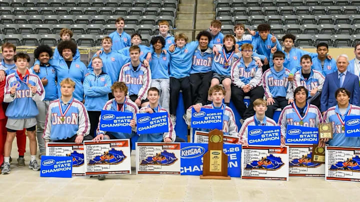 The Union County wrestling team displays its championship hardware and placards at the Kentucky State Championships Feb.28, 2026. 