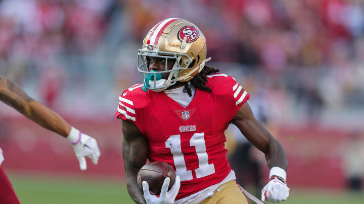 Dec 24, 2022; Santa Clara, California, USA; San Francisco 49ers wide receiver Brandon Aiyuk (11) runs with the ball during the third quarter against the Washington Commanders at Levi's Stadium. Mandatory Credit: Sergio Estrada-USA TODAY Sports Dec 24, 2022; Santa Clara, California, USA; San Francisco 49ers wide receiver Brandon Aiyuk (11) runs with the ball during the third quarter against the Washington Commanders at Levi's Stadium. Mandatory Credit: Sergio Estrada-USA TODAY Sports