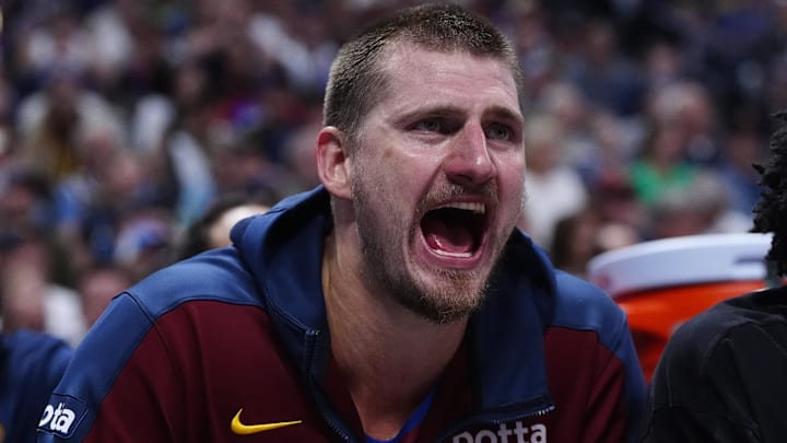 May 3, 2025; Denver, Colorado, USA; Denver Nuggets center Nikola Jokic (15) reacts from the bench in the third quarter against the LA Clippers during game seven of first round for the 2025 NBA Playoffs at Ball Arena. Mandatory Credit: Ron Chenoy-Imagn Images