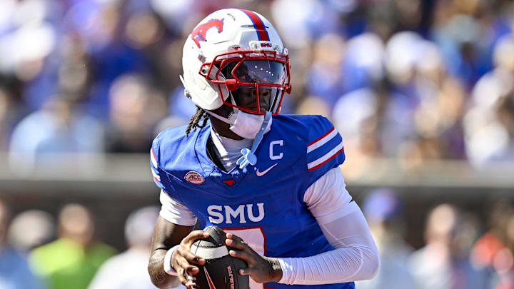 Oct 4, 2025; Dallas, Texas, USA; SMU Mustangs quarterback Kevin Jennings (7) drops back to pass the ball during the first half against the Syracuse Orange at Gerald J. Ford Stadium. Mandatory Credit: Jerome Miron-Imagn Images