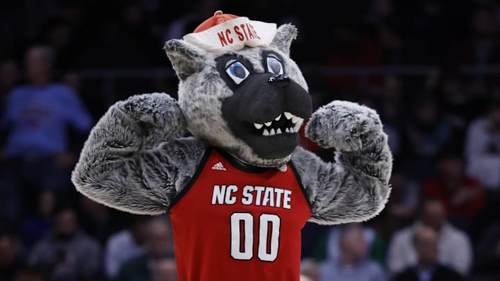 Mar 17, 2026; Dayton, OH, USA; The NC State Wolfpack mascot “Mr. Wuf” performs in the first half against the Texas Longhorns during a first four game of the men's 2026 NCAA Tournament at University of Dayton Arena. Mandatory Credit: Rick Osentoski-Imagn Images