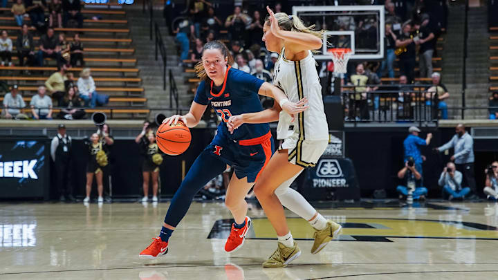 Illinois forward Berry Wallace drives against a Purdue defender in the Illini's win over the Boilermakers on Sunday at Mackey Arena in West Lafayette, Indiana.