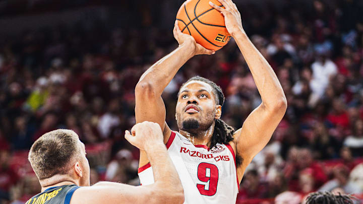 Jonas Aidoo rises (9) rises for a shot over North Carolina A&T's Efstratios Kalliontzis (31) inside Bud Walton Arena. The Razorbacks won 95-67. 