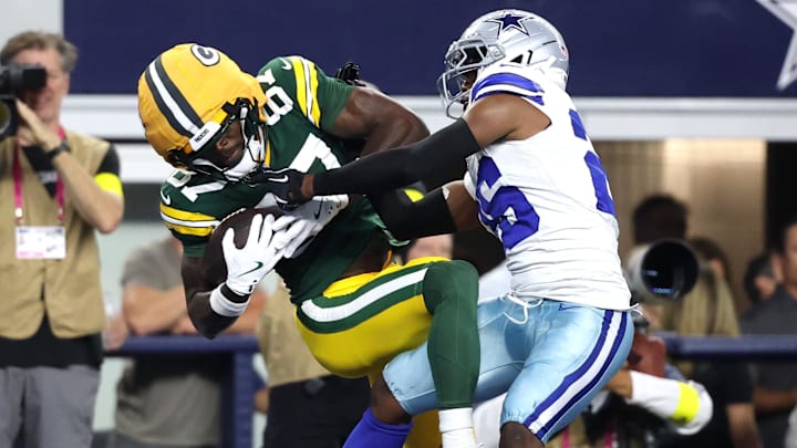 Green Bay Packers wide receiver Romeo Doubs (87) makes a catch for a touchdown against Dallas Cowboys cornerback DaRon Bland (26) in the first quarter at AT&T Stadium.