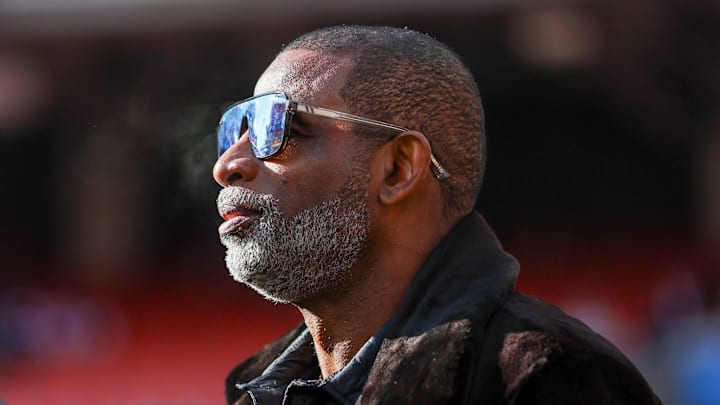 Dec 21, 2025; Cleveland, Ohio, USA;  Legendary  football and baseball player and father of Cleveland Browns quarterback Shedeur Sanders, Deion Sanders on the sidelines prior to a game against the Buffalo Bills at Huntington Bank Field. Credit: Scott Galvin-Imagn Images