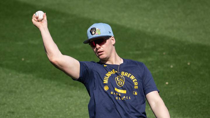 Milwaukee Brewers infielder Luke Adams plays catch during spring training workouts Tuesday, February 17, 2026, at American Family Fields of Phoenix in Phoenix, Arizona.