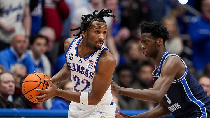 Kansas Jayhawks guard Darryn Peterson (22) looks to pass against BYU Cougars forward AJ Dybantsa (3)