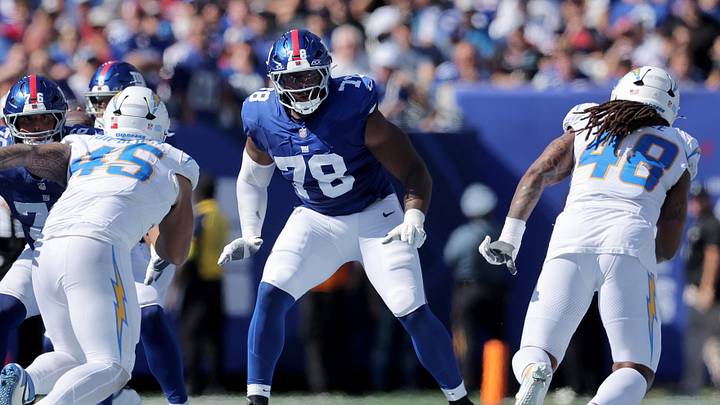 Sep 28, 2025; East Rutherford, New Jersey, USA; New York Giants offensive tackle Andrew Thomas (78) blocks against Los Angeles Chargers linebackers Tuli Tuipulotu (45) and Bud Dupree (48) during the second quarter at MetLife Stadium. Mandatory Credit: Brad Penner-Imagn Images Sep 28, 2025; East Rutherford, New Jersey, USA; New York Giants offensive tackle Andrew Thomas (78) blocks against Los Angeles Chargers linebackers Tuli Tuipulotu (45) and Bud Dupree (48) during the second quarter at MetLife Stadium. Mandatory Credit: Brad Penner-Imagn Images