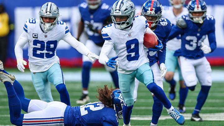 Dallas Cowboys wide receiver Kavontae Turpin returns a kickoff as New York Giants punter Jamie Gillan pursues.