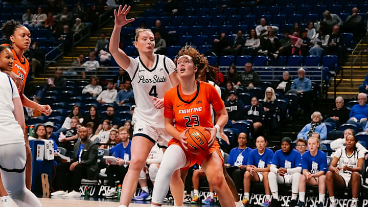 Illinois forward Berry Wallace (23) takes Penn State forward Maggie Mendelson (4) off the dribble in the Illini's 92-76 win over the Nittany Lions at the Bryce Jordan Center in University Park, Pennsylvania. Illinois forward Berry Wallace (23) takes Penn State forward Maggie Mendelson (4) off the dribble in the Illini's 92-76 win over the Nittany Lions at the Bryce Jordan Center in University Park, Pennsylvania.