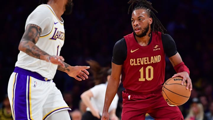 Apr 6, 2024; Los Angeles, California, USA;  Cleveland Cavaliers guard Darius Garland (10) moves the ball against Los Angeles Lakers guard D’Angelo Russell (1) during the first half at Crypto.com Arena. Mandatory Credit: Gary A. Vasquez-Imagn Images