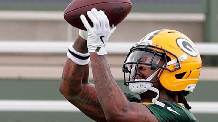 Green Bay Packers safety Xavier McKinney catches a pass during drills at minicamp in 2025.