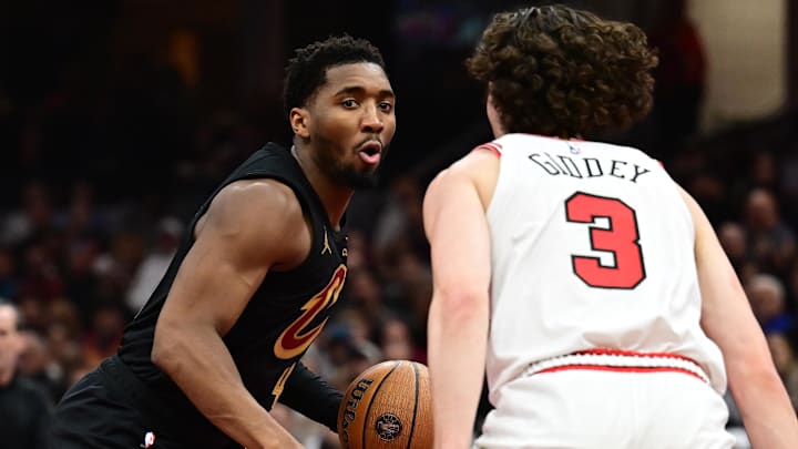 Nov 15, 2024; Cleveland, Ohio, USA; Chicago Bulls guard Josh Giddey (3) defends Cleveland Cavaliers guard Donovan Mitchell (45) during the first half at Rocket Mortgage FieldHouse. Mandatory Credit: Ken Blaze-Imagn Images