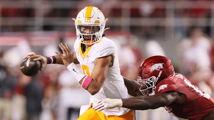 Tennessee Volunteers quarterback Nico Iamaleava (8) scrambles out of the pocket in the second quarter against the Arkansas Razorbacks at Razorback Stadium. 
