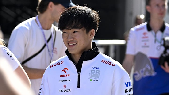 Oct 18, 2024; Austin, Texas, USA; Visa Cash App RB Formula One Team driver Yuki Tsunoda (22) of Team Japan walks through the paddock area before practice for the 2024 US Grand Prix at Circuit of the Americas. Mandatory Credit: Jerome Miron-Imagn Images