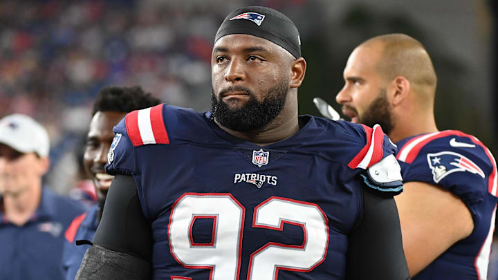 Aug 19, 2022; Foxborough, Massachusetts, USA; New England Patriots defensive tackle Davon Godchaux (92) on the sideline during the first half of a preseason game against the Carolina Panthers at Gillette Stadium. Mandatory Credit: Eric Canha-Imagn Images