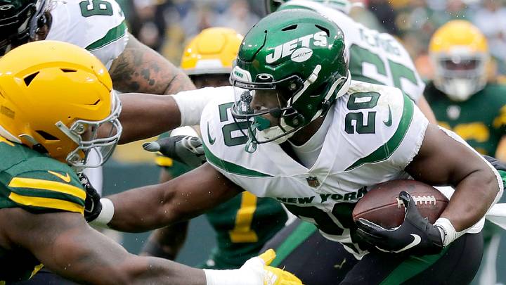 Green Bay Packers defensive tackle Kenny Clark (97) tackles New York Jets running back Breece Hall in 2022. Green Bay Packers defensive tackle Kenny Clark (97) tackles New York Jets running back Breece Hall in 2022.