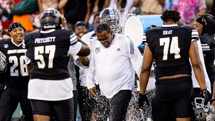 Feb 25, 2023; New Orleans, LA, USA; Team Robinson co-head coach Chennis Berry has a bucket of water dumped on him after the game against Team Gaither during the second half of the HBCU Legacy Bowl at Yulman Stadium. Mandatory Credit: Stephen Lew-Imagn Images