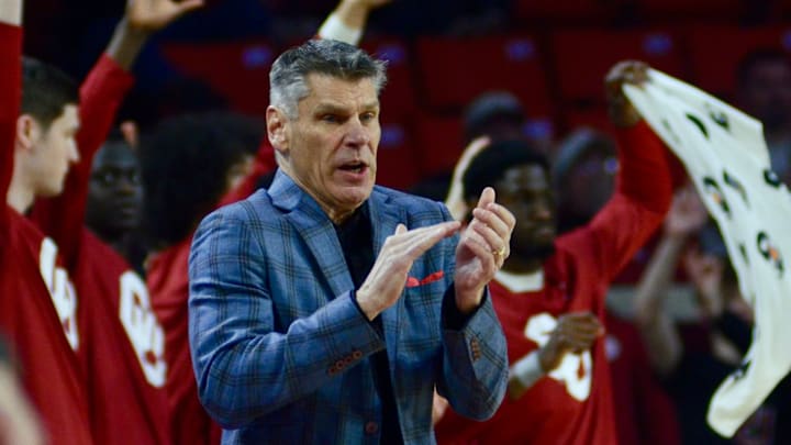 Oklahoma coach Porter Moser celebrates after a made 3-pointer against Auburn.