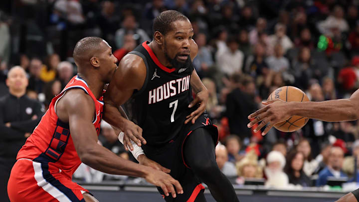 Dec 23, 2025; Inglewood, California, USA;  Houston Rockets forward Kevin Durant (7) turns the ball over as Los Angeles Clippers forward Kawhi Leonard (2) steals during the third quarter at Intuit Dome. Mandatory Credit: Kiyoshi Mio-Imagn Images