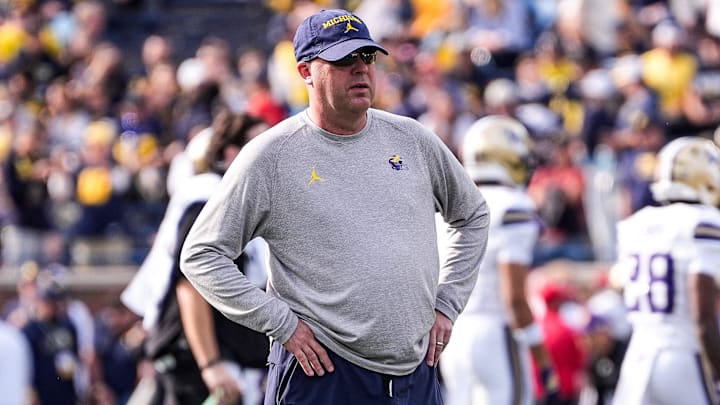 Michigan offensive coordinator Chip Lindsey watches warmup ahead of the Washington game at Michigan Stadium in Ann Arbor on Saturday, Oct. 18, 2025.