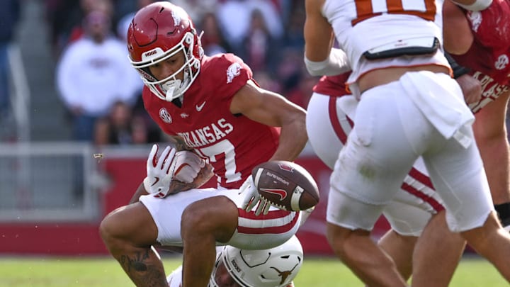 Arkansas Razorbacks wide receiver CJ Brown has the ball stripped from him by Texas Longhorns defensive lineman Alfred Collins. Arkansas Razorbacks wide receiver CJ Brown has the ball stripped from him by Texas Longhorns defensive lineman Alfred Collins.