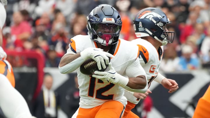 Nov 2, 2025; Houston, Texas, USA; Denver Broncos running back RJ Harvey (12) runs during the first half against the Houston Texans at NRG Stadium. Mandatory Credit: Sean Thomas-Imagn Images