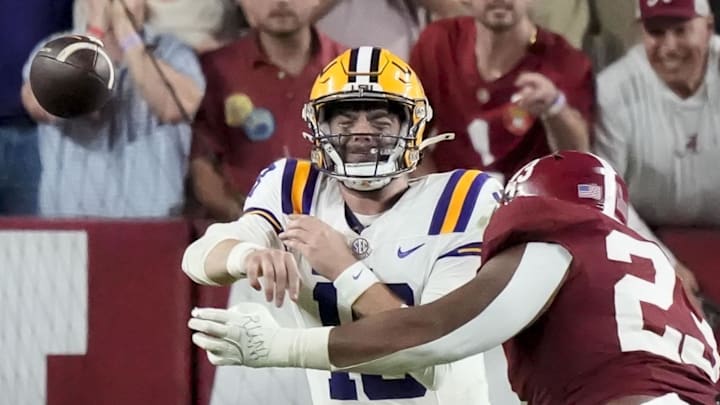 Nov 8, 2025; Tuscaloosa, Alabama, USA; Alabama defensive lineman James Smith (23) forces a bad throw on third down play from LSU quarterback Garrett Nussmeier (18) at Saban Field at Bryant-Denny Stadium. Mandatory Credit: Gary Cosby Jr.-Imagn Images Nov 8, 2025; Tuscaloosa, Alabama, USA; Alabama defensive lineman James Smith (23) forces a bad throw on third down play from LSU quarterback Garrett Nussmeier (18) at Saban Field at Bryant-Denny Stadium. Mandatory Credit: Gary Cosby Jr.-Imagn Images