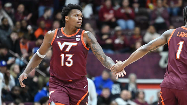 Jan 31, 2026; Blacksburg, Va.; Virginia Tech forward Tobi Lawal (1) congratulates forward Amani Hansberry (13) on a basket.